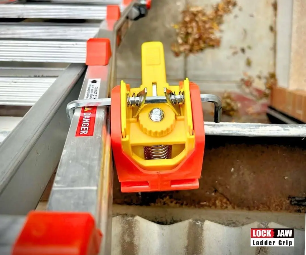 Lock Jaw Ladder Grip securely clamps the ladder to the gutter, preventing movement and enhancing safety for workers at heights.