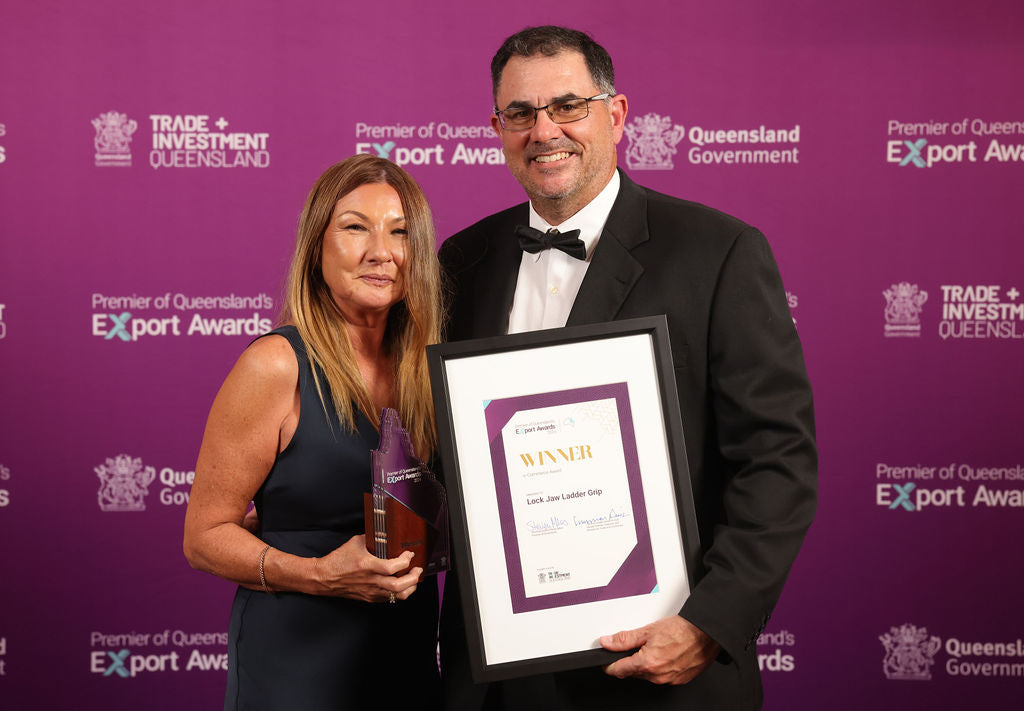 Gail and Craig won a prestigious award from Trade and Investment Queensland (TIQ) 2024 Export in A pink backdrop